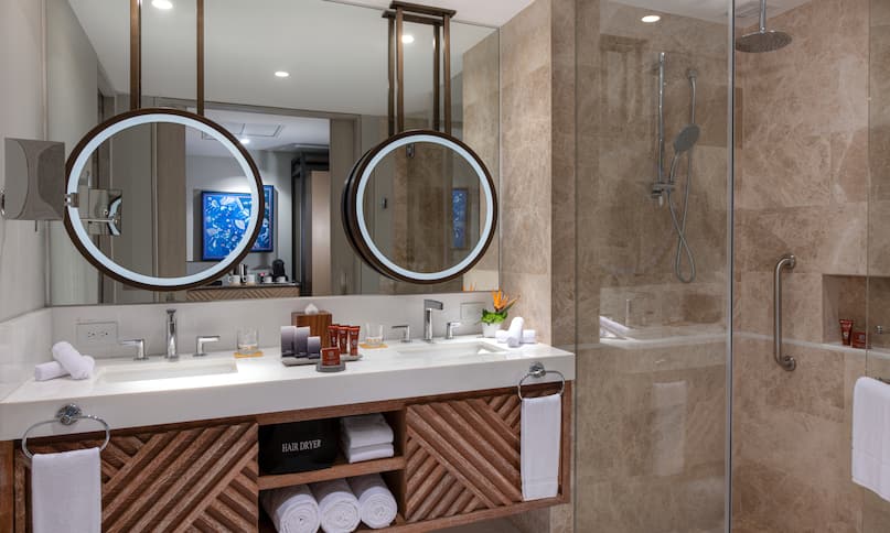 Bathroom with Dual Vanity Area and Lit Mirrors
