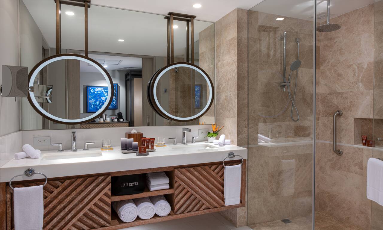 Bathroom with Dual Vanity Area and Lit Mirrors