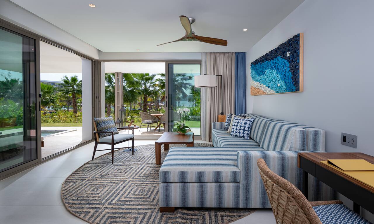 Suite Living Room with Pool Area and Partial View of the Ocean