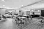 Hotel breakfast area with communal tables and seating.