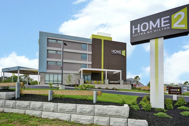 Daytime View of Home2 Hotel Exterior with Sign