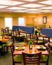 Tables, Chairs, and Booth Seating in Restaurant Dining Area 