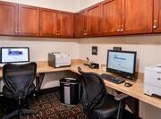 Business Center with Two Desktop Computers, Two Printers and Two Computer Chairs