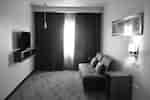 Sitzbereich der Suite mit 1 Kingsize-Bett 