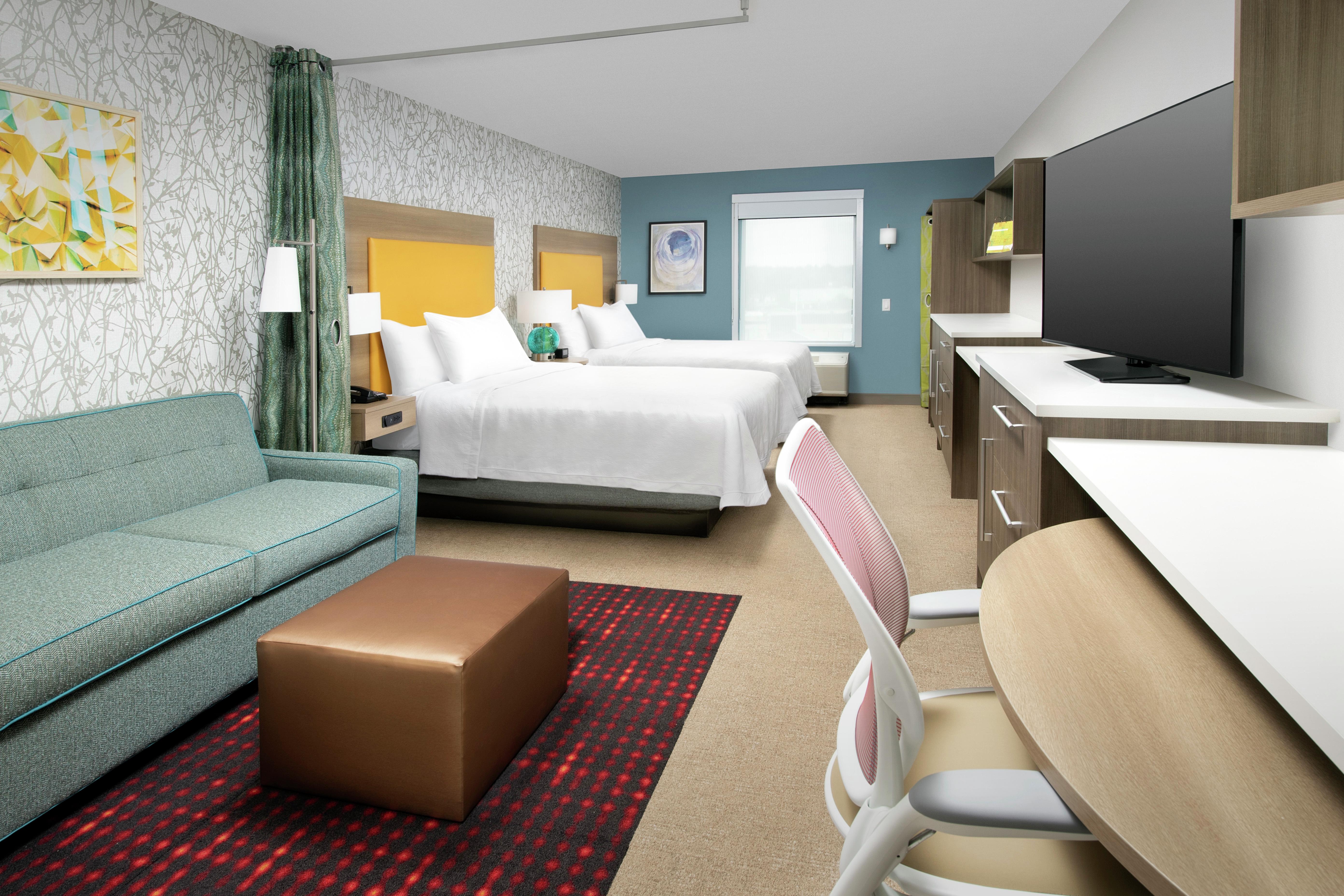 Two Queen Beds and Seating Area in Suite