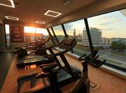 Fitness Center with City View at Sunset