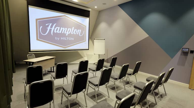 Meeting Room Setup Theater Style with Projection Screen