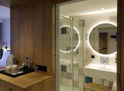 Bathroom Vanity Area and Shower in Accessible Queen Room