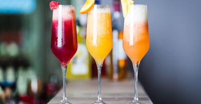 A flight of different mimosas/cocktails.