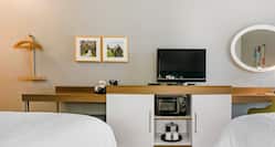 Streamline Unity with HDTV, Microwave, Desk and Storage Space in Queen Room