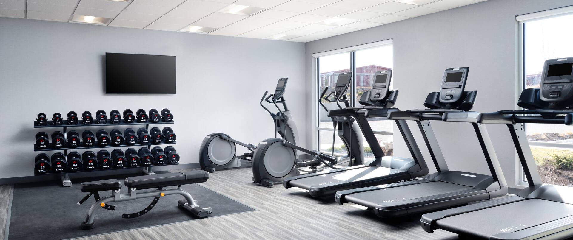 Fitness Center with Treadmills Recumbent Bikes Weights and HDTV