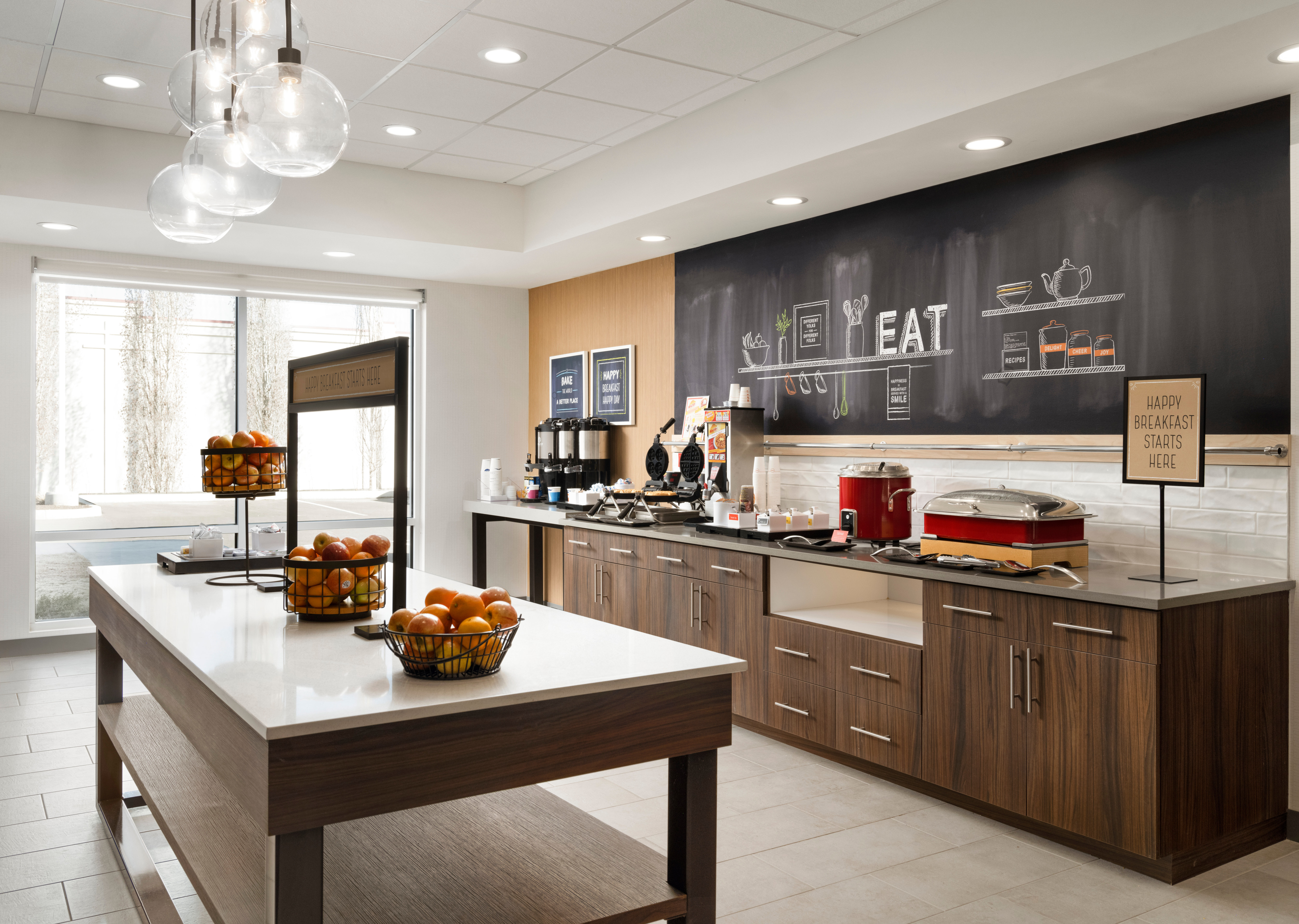 Breakfast Bar Area with Fresh Fruits and Hot Foods