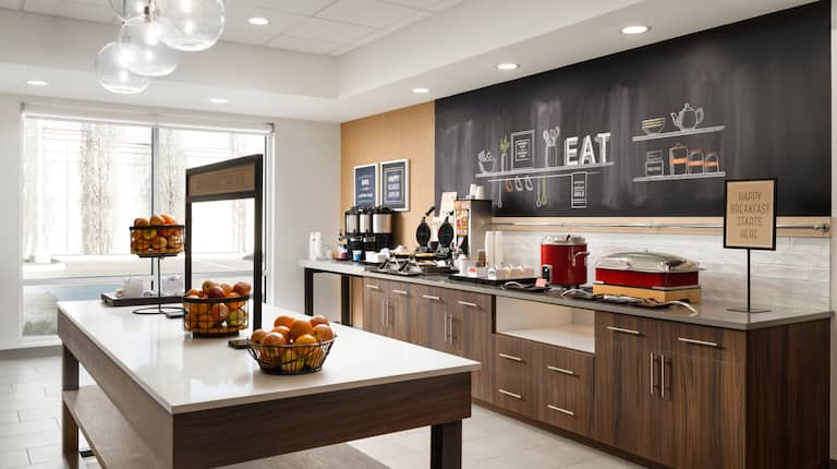 Breakfast Bar Area with Fresh Fruits and Hot Foods