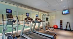 Fitness Center with View of Swimming Pool 