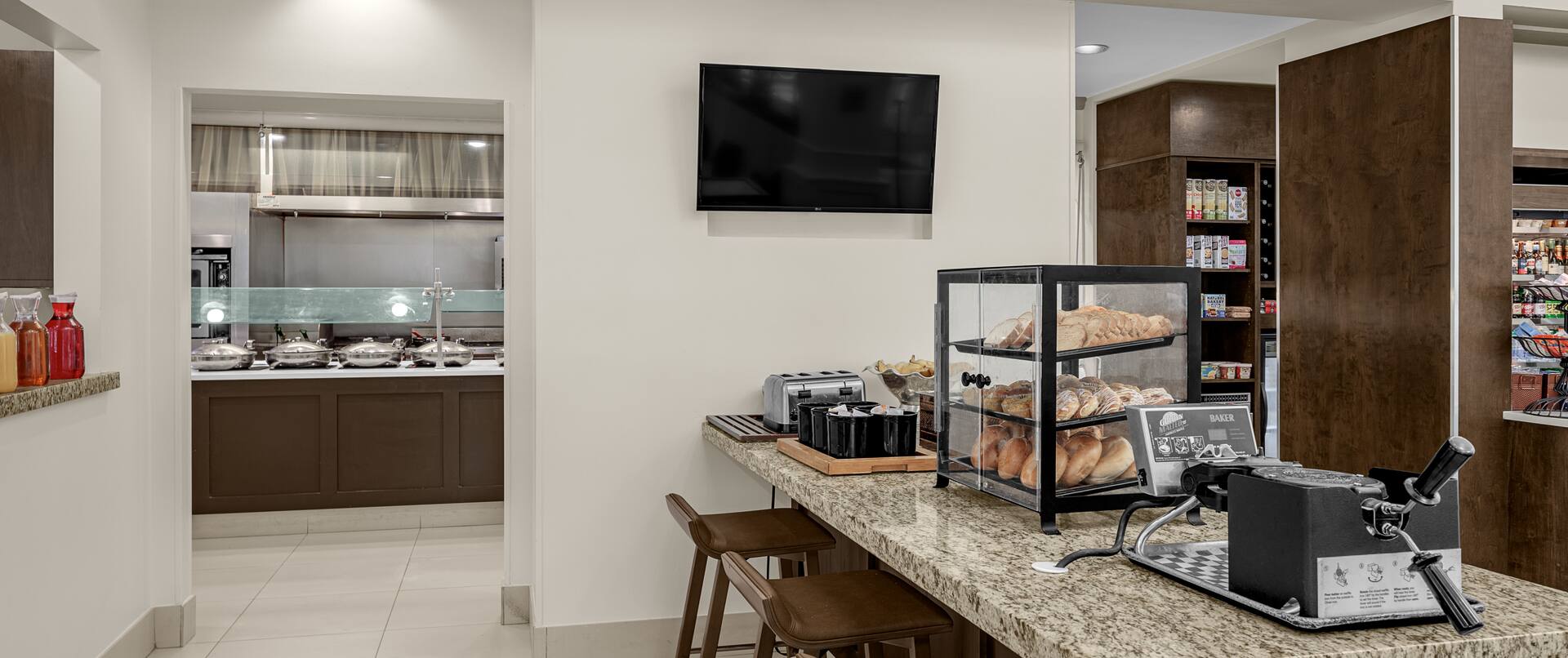 Breakfast area with food options and TV