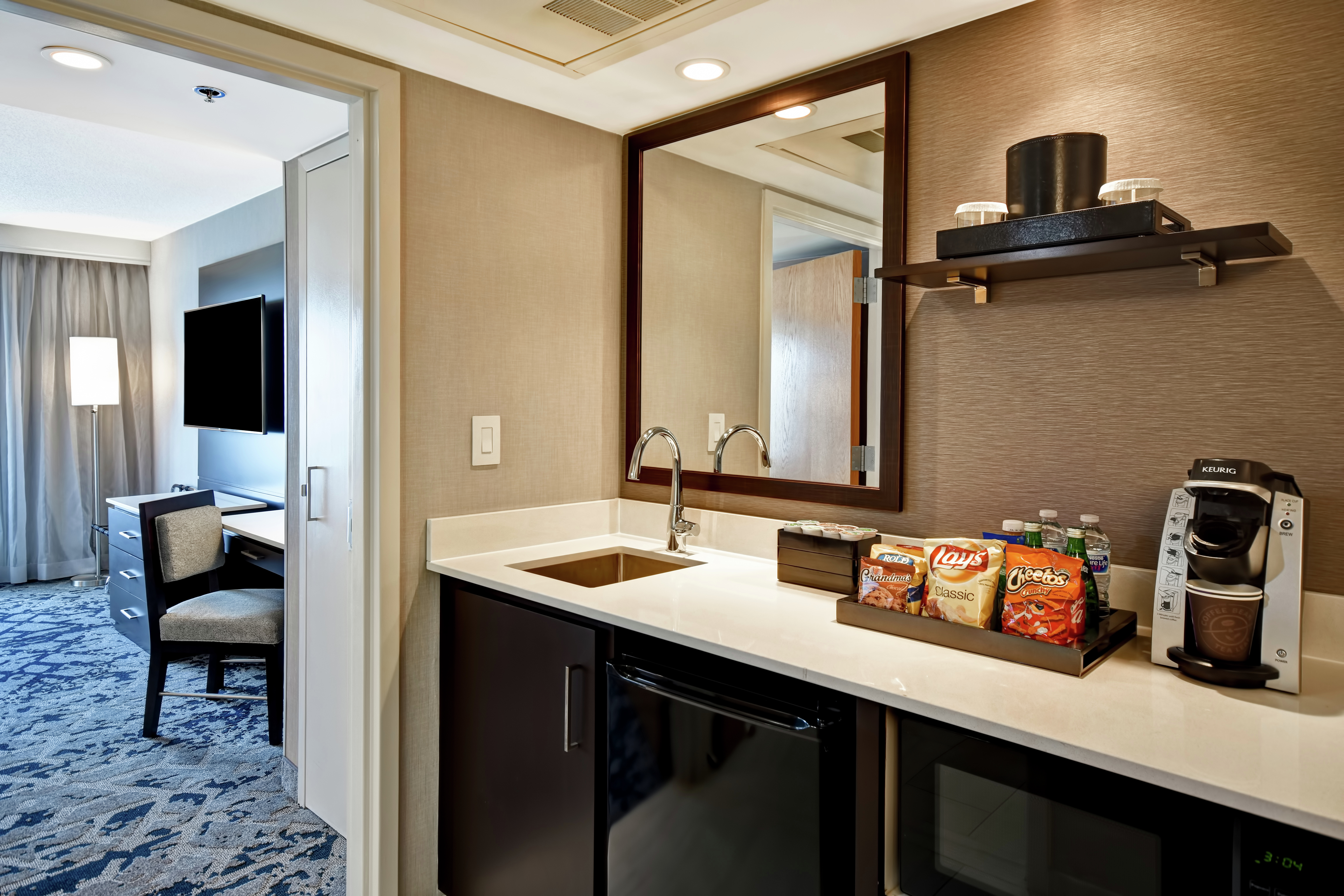 Guestroom Wet Bar With Keurig And Snack Tray Amenities