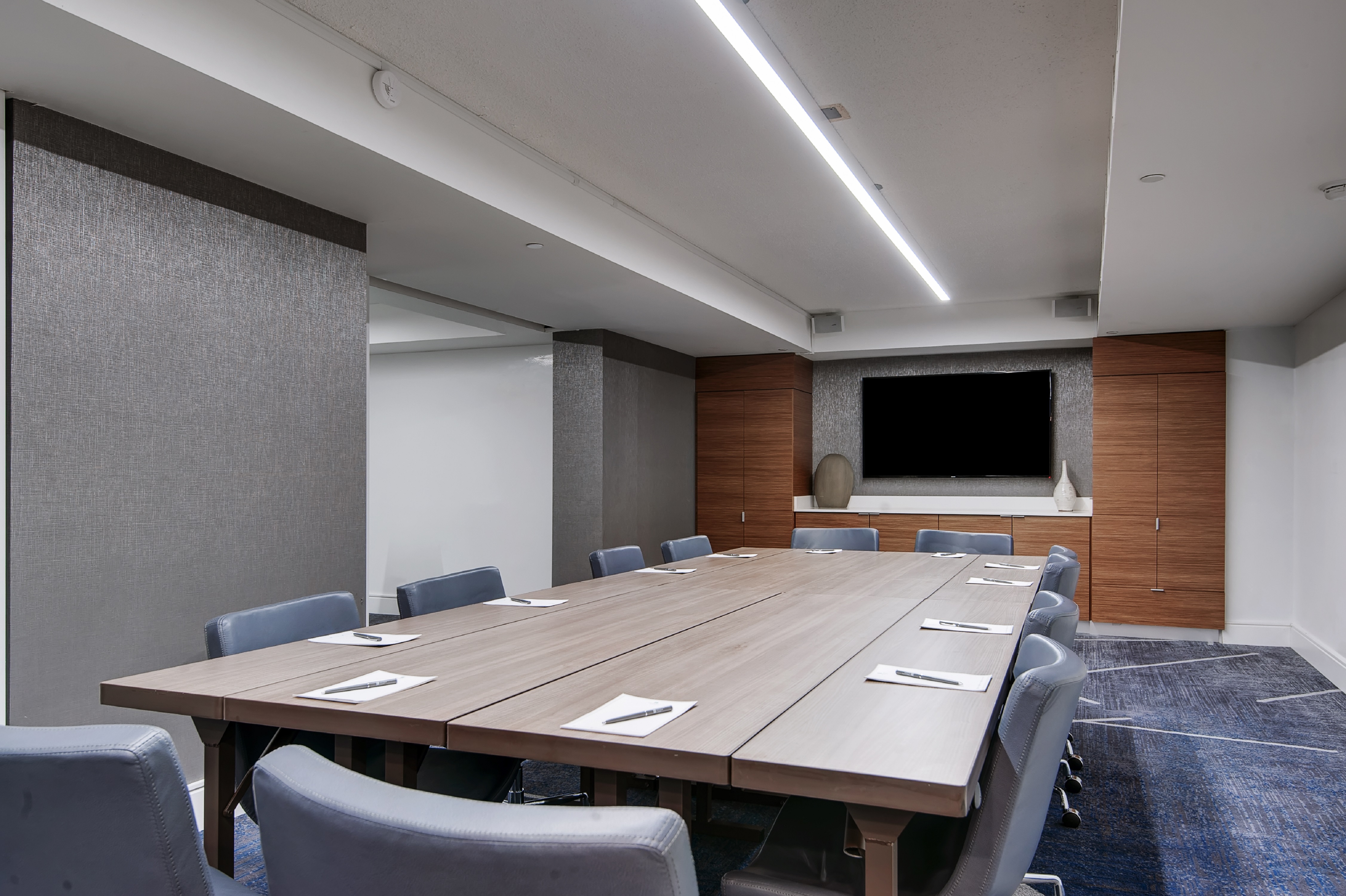 Boardroom with Large Table Chairs and TV