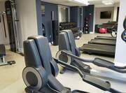 24 Hour Fitness Center with Strength Equipment Treadmills and Weights