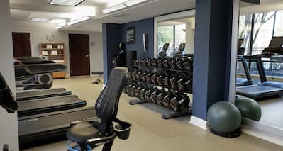 24 Hour Fitness Center with Treadmills and Weights