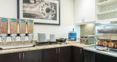 Homewood Suites Raleigh-Durham AP/Research Triangle Hotel, NC - Breakfast Area with cereal options, toaster, and bagel selections