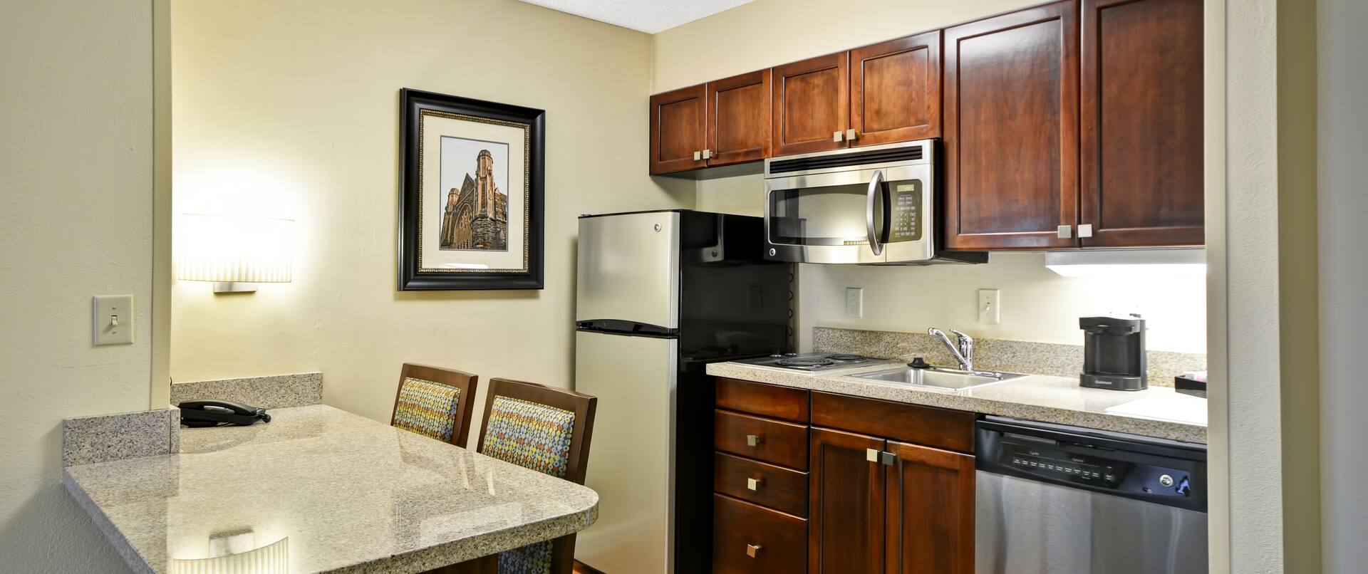 Guest Suite Kitchen Area with Refridgerator, Microwave and Dishwasher