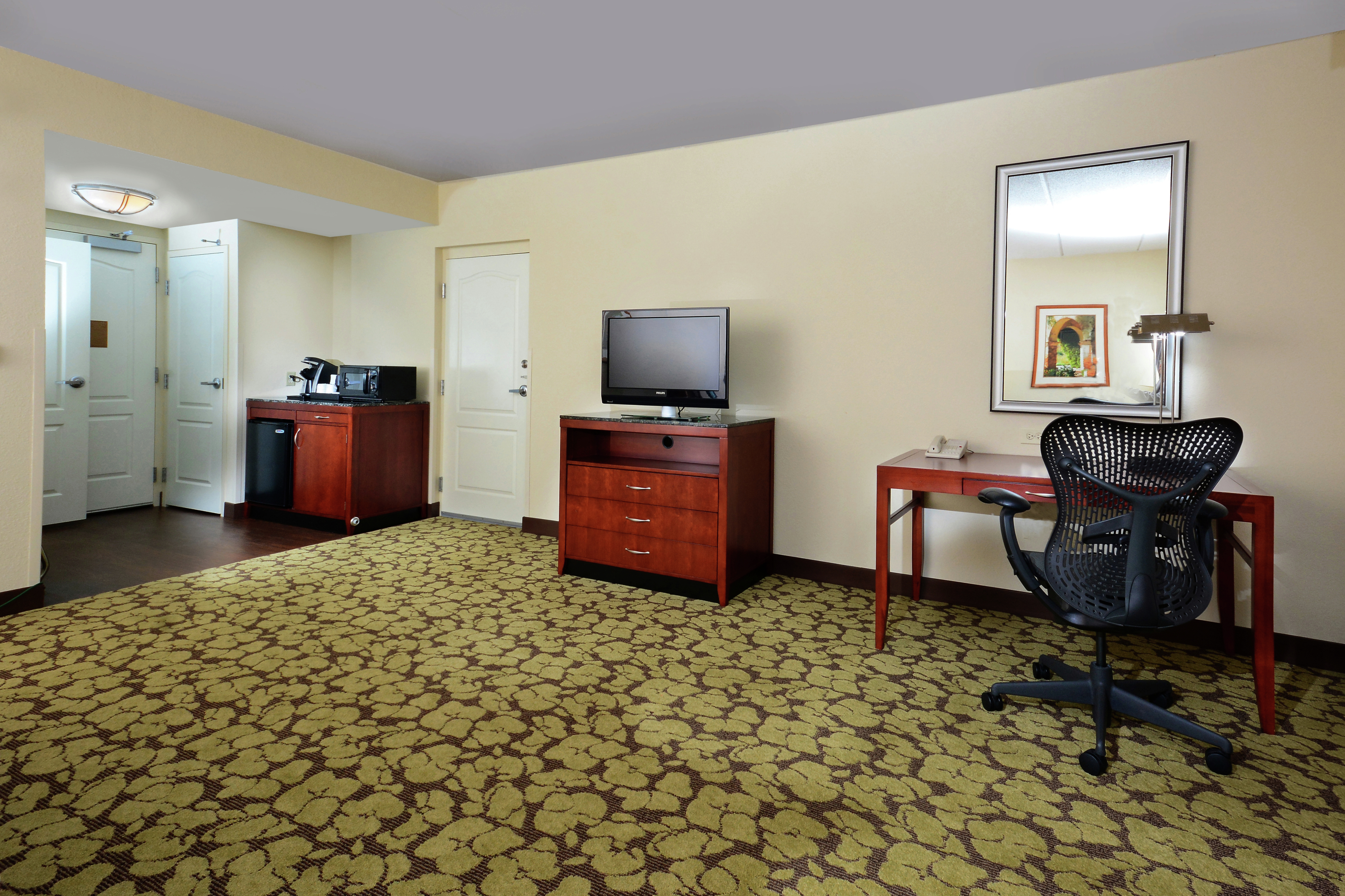 Accessible King Room Lounge Area with Work Desk, Television and Kitchenette