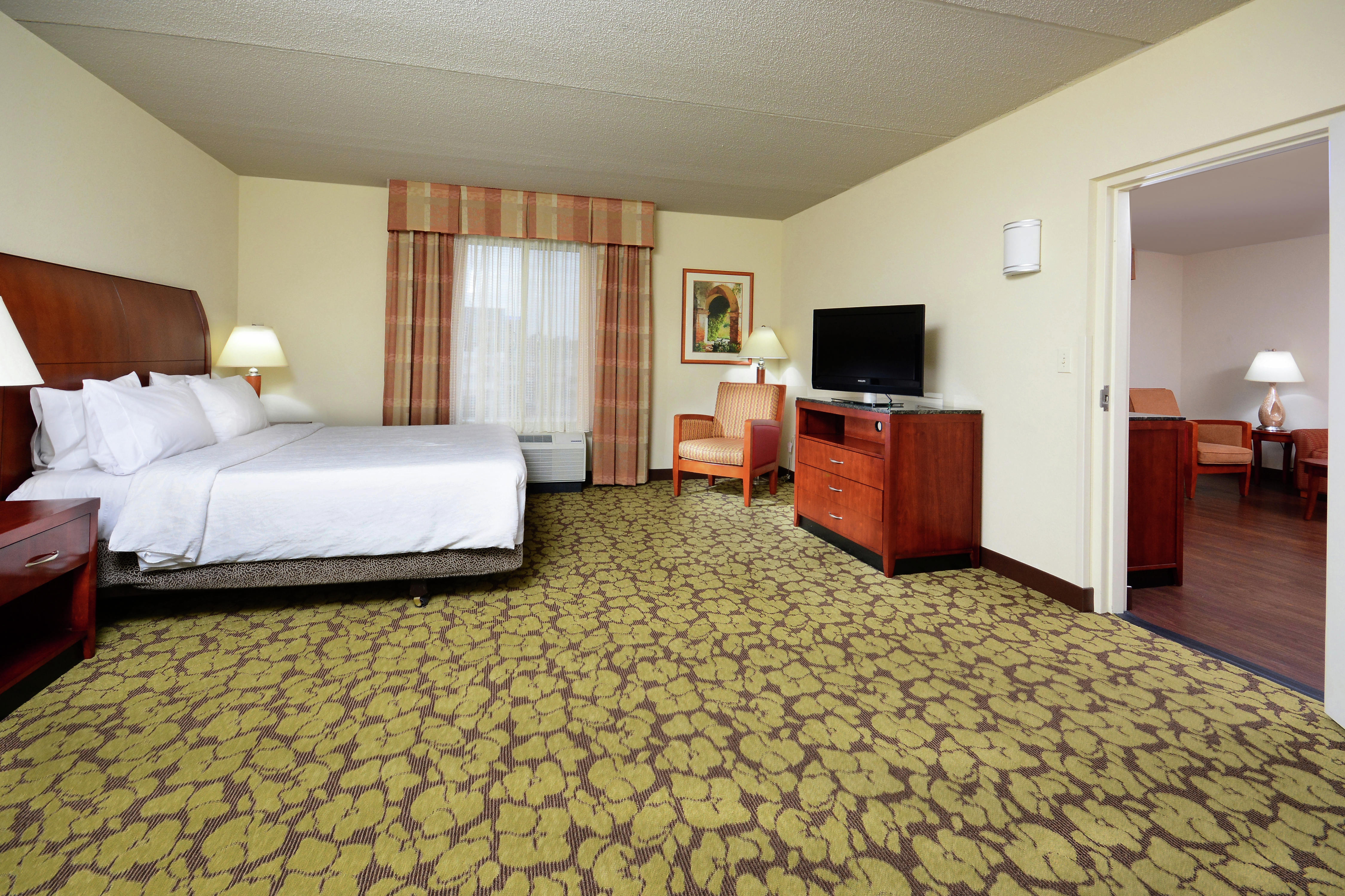 Guest Suite with King Bed, Television and Separate Lounge Area