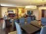 Presidential Suite Living Area with Lounge Seating, Television and Dining Table