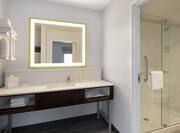 Bathroom Vanity Area with Lit Mirror and Glassdoor Shower
