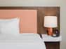Detail of Bed and Nightstand in Hotel Guest Room