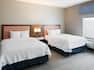 Two Queen size Beds in Hotel Guest Room
