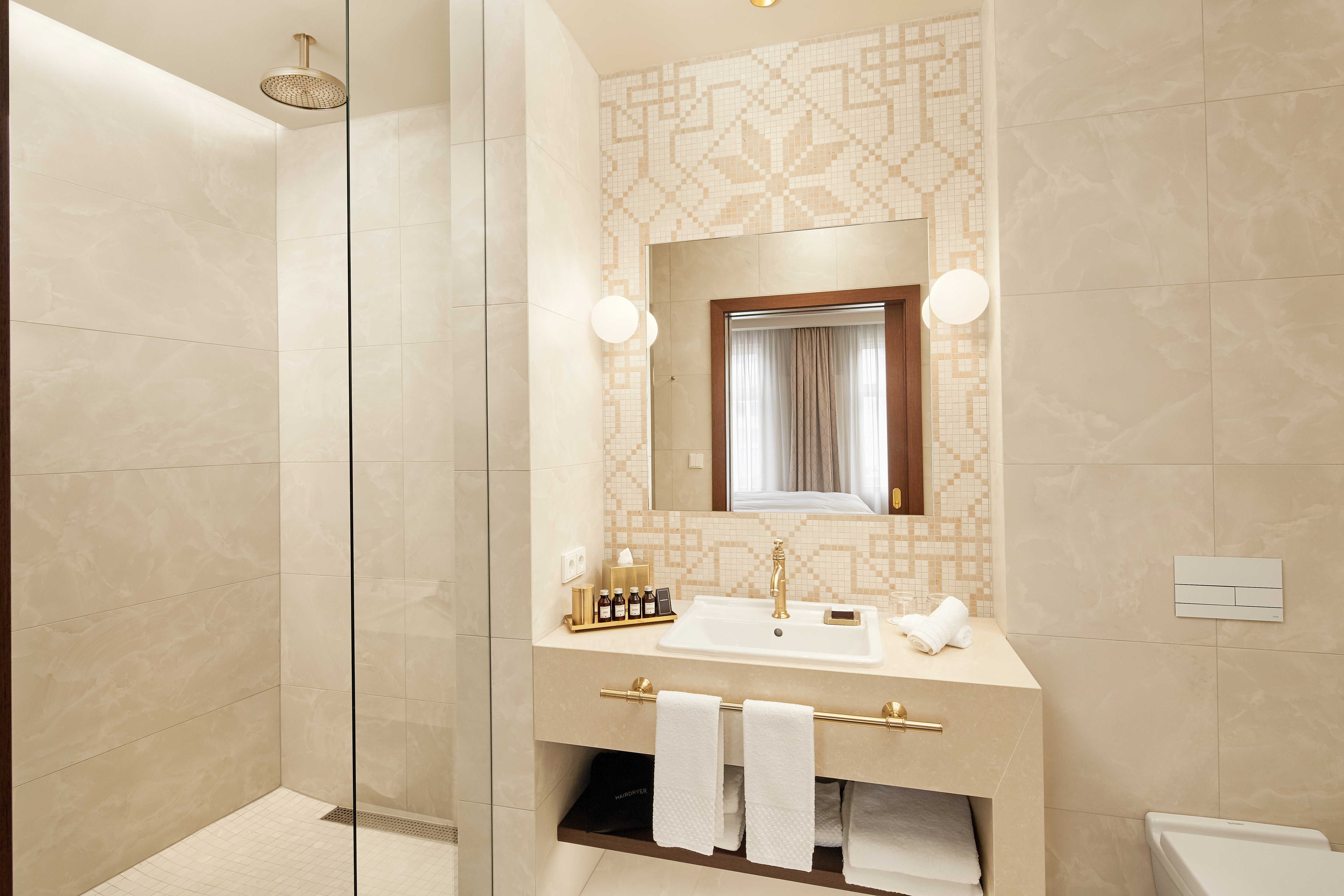Premier Suite Bathroom with Vanity, Mirror and Shower with Glass Door