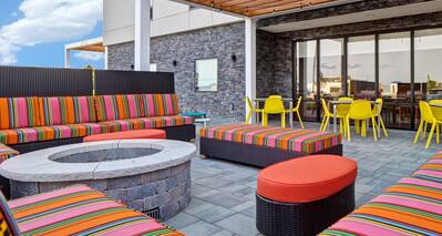 exterior patio with fire pit in the day