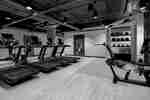 fitness center with exercise machines and weights