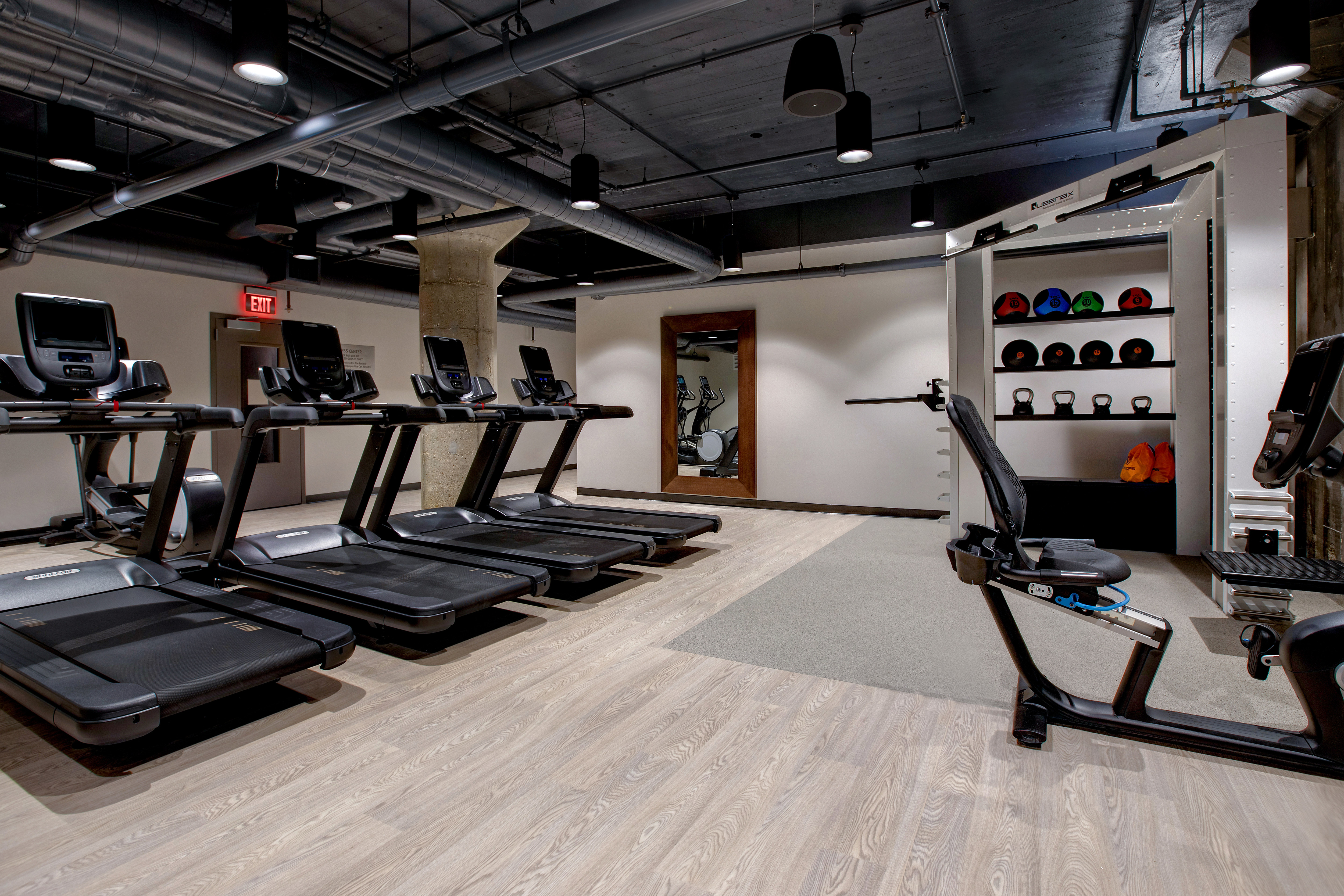 fitness center with exercise machines and weights