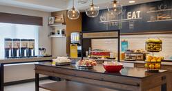 Breakfast Bar Area with Fresh Fruits and Drinks