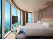Large Bed in Guest Room with HDTV and Panoramic Sea View