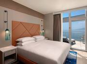 Large Bed in Suite with Sea View from Balcony