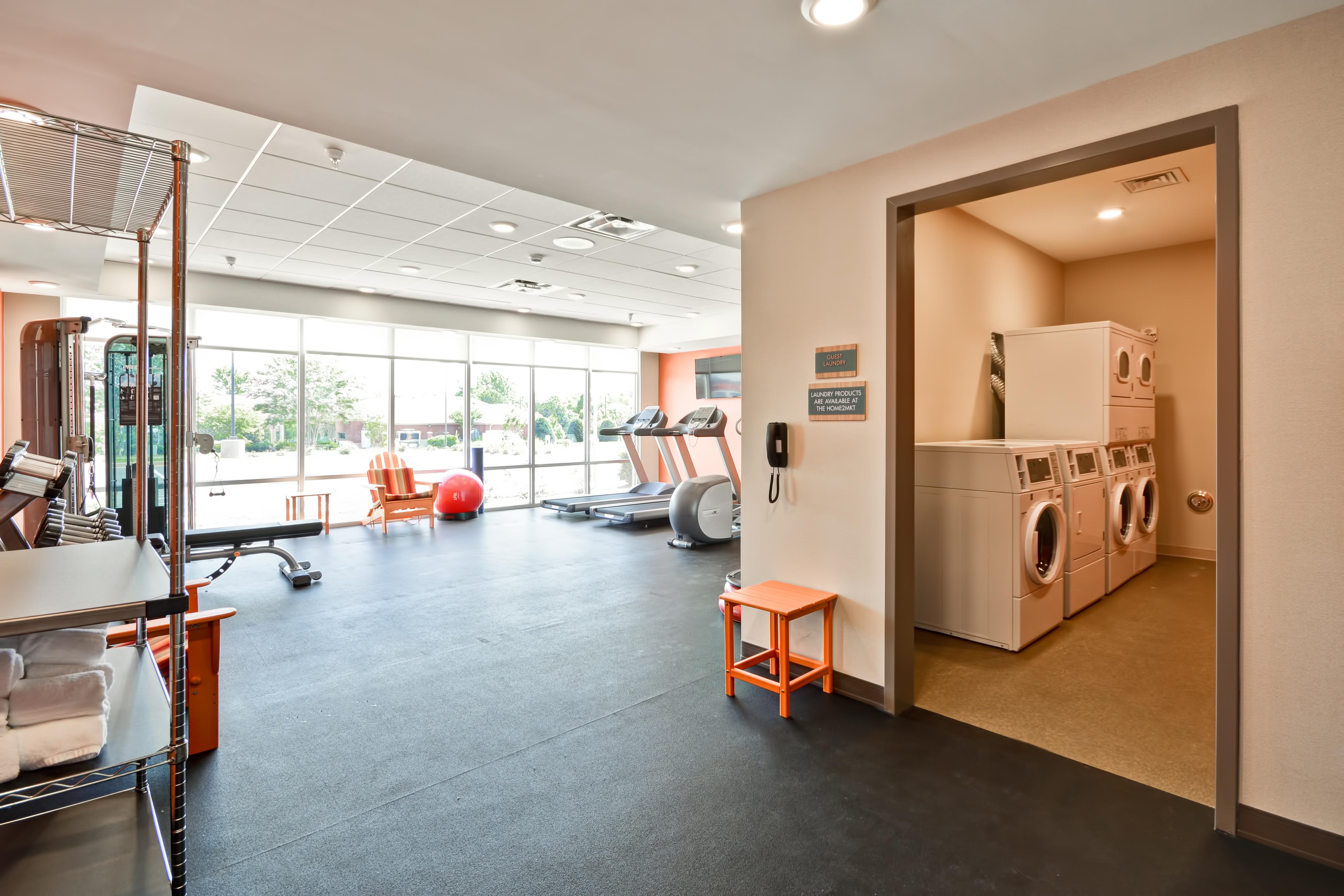 Fitness Center with Treadmills, Weight Bench and Weight Machine and Laundry Room