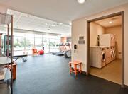 Fitness Center with Treadmills, Weight Bench and Weight Machine and Laundry Room