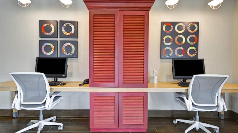Business Center with Two Desktop Computers, Two Office Chairs and Red Cabinet