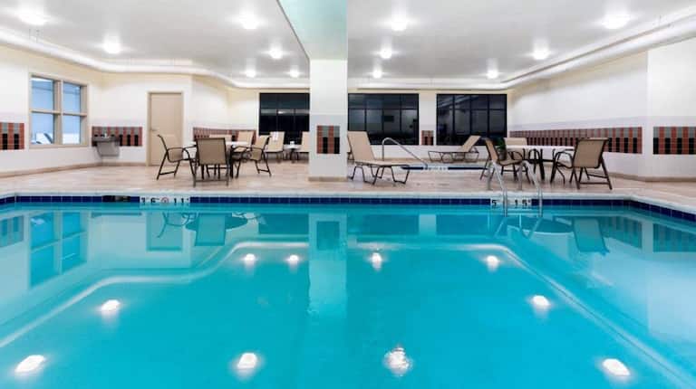 Indoor pool with tables and chairs