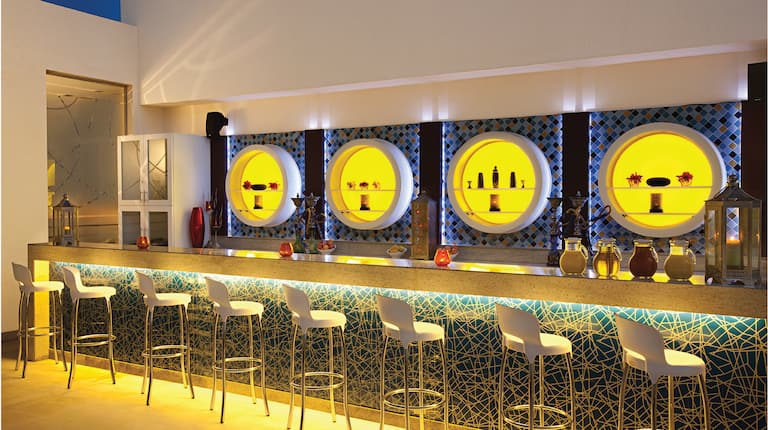 Bar area with stools and lighting