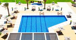 Aerial View of Outdoor Pool and Lounge Seating ona Sunny Day