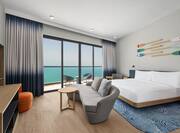 King Guest Room with Sofa HDTV and Sea View