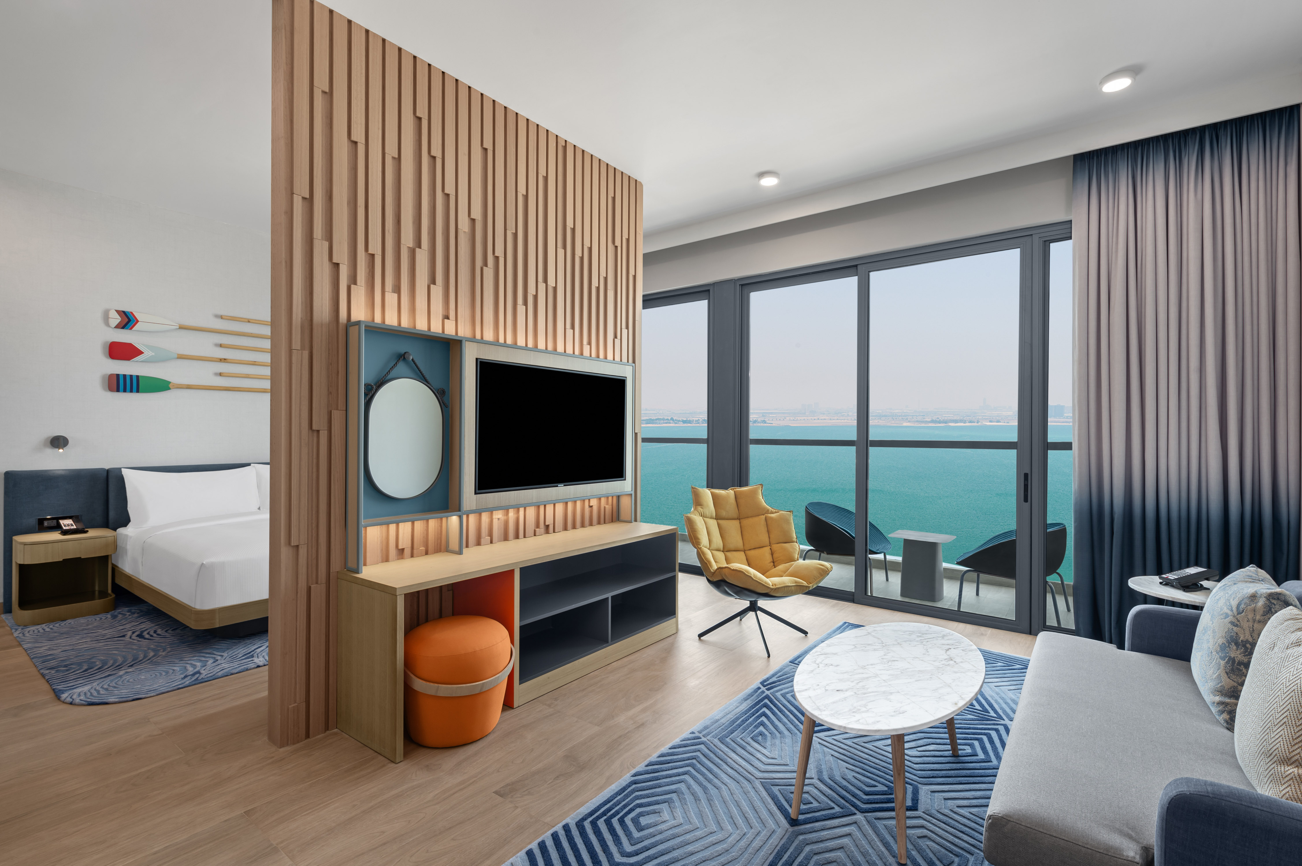 Guest Room Living Area with Sea View and Partial View of Bedroom