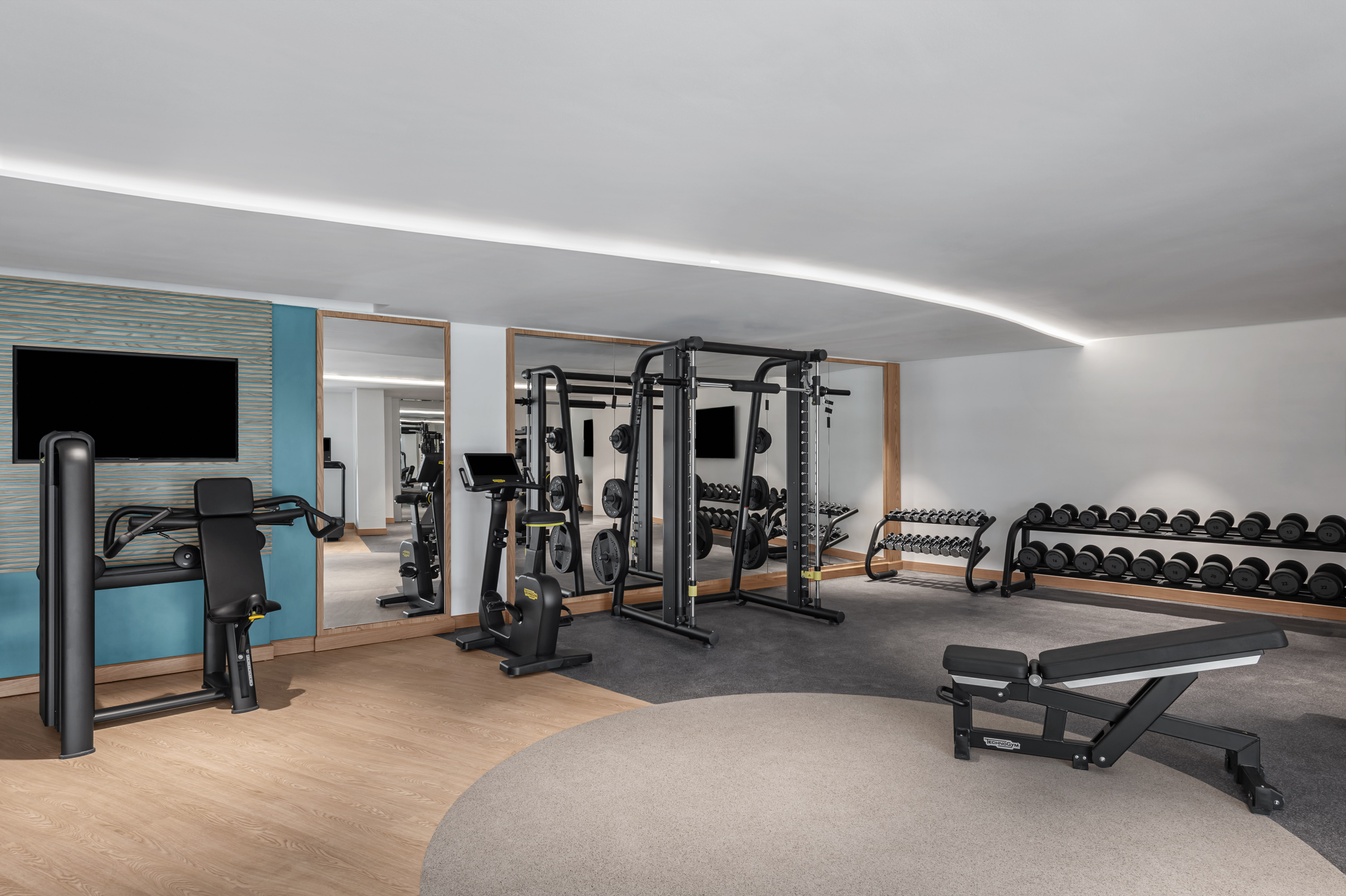 Fitness Center with Weights HDTV and other Modern Equipment 