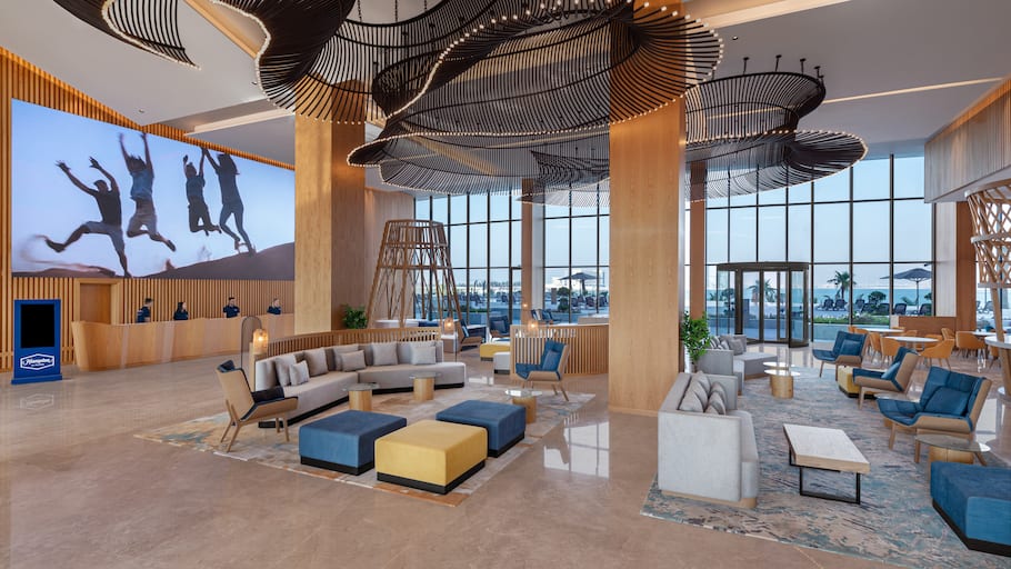 Bright Seating Area in Lobby with Sea View and Reception Area