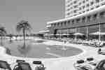 View of Outdoor Pool and Pool Deck with Lounge Chairs