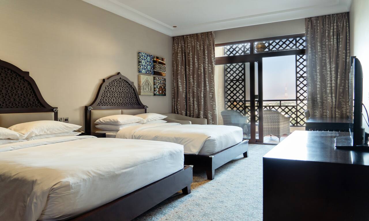 Two Queen Beds in Family Guest Room with Sea View from Balcony